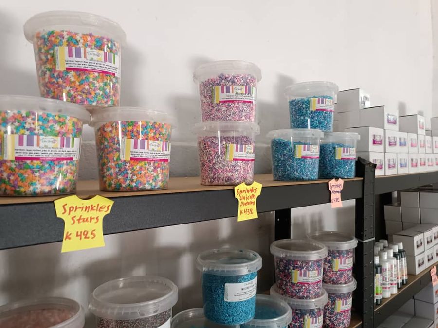 Cake Flora sprinkles tubs on Artion shelves